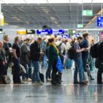 American Airlines cracks down against 'gate lice' as airport passengers skip lines amid boarding process