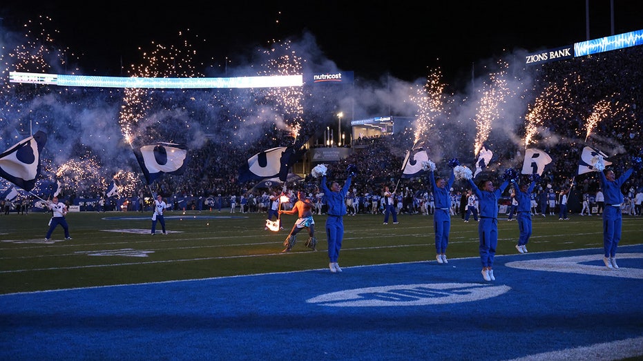 BYU cheerleading coach 'lost consciousness' after being struck in head with water bottle, Utah fan arrested