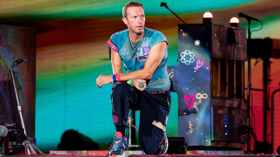 Coldplay frontman Chris Martin falls through trapdoor on Australia stage