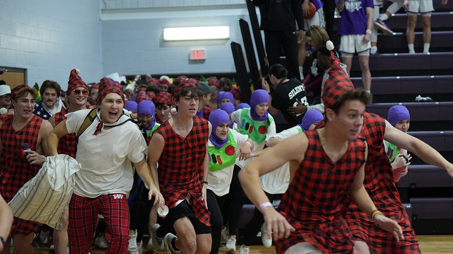 College basketball fans break silence, storm the court as part of unique Christmas tradition