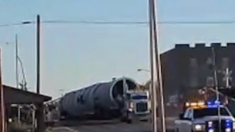 Texas train derails after hitting tractor-trailer, barreling into city building: video