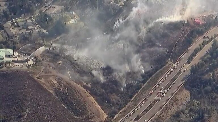 Residents evacuated as brush fire threatens homes near San Diego