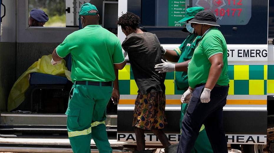 Dozens of survivors and dead pulled from abandoned South African mine as hundreds remain underground