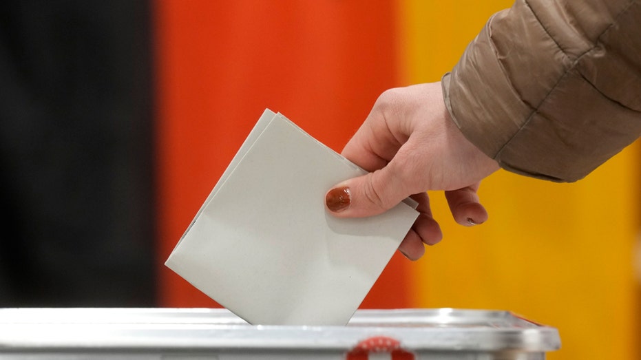 Conservative candidate pulls ahead in German election, according to early exit polls