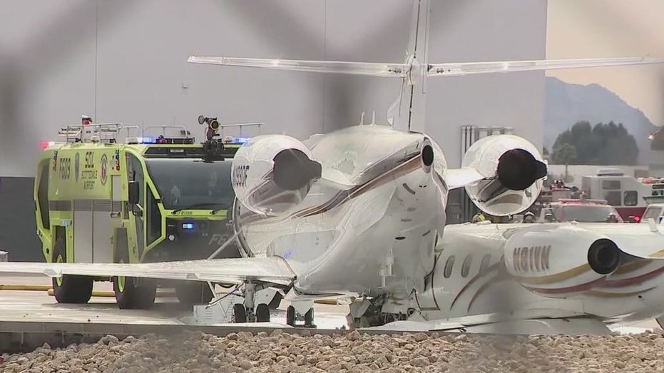 Scottsdale plane crash: 1 dead, 4 injured after small jet smashes into bigger jet as landing gear fails