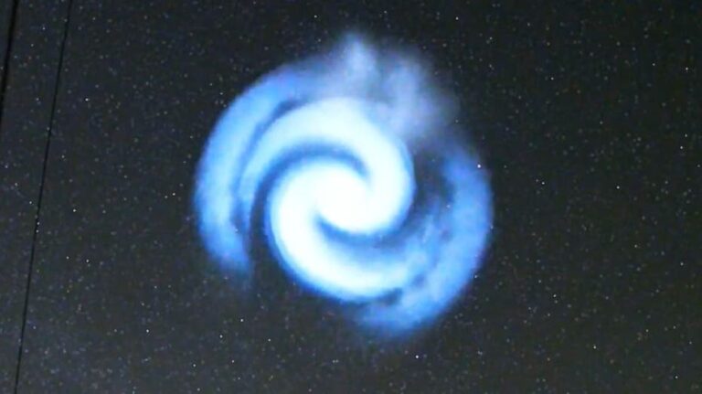 Spectacular blue spiral light brightens up night sky, likely from Space X rocket