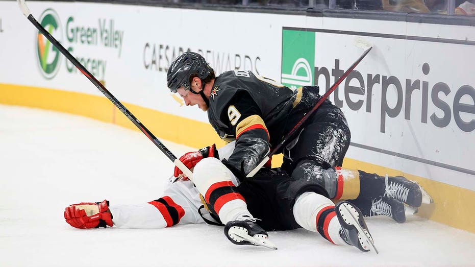 Devils' Jack Hughes suffers gruesome shoulder injury after after crashing into boards