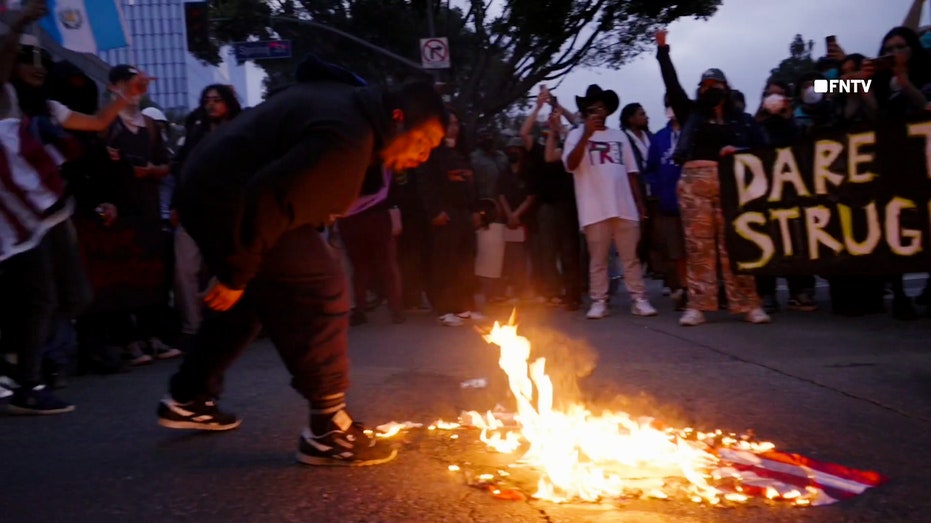 Anti-ICE protesters in Los Angeles spit on and burn American flag