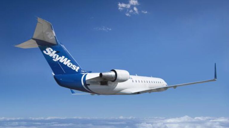 SkyWest flight diverted after passenger tries to open emergency door, fights with flight attendant: report