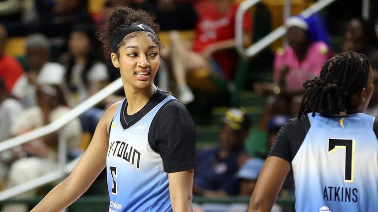 Sky star Angel Reese reacts after slapping clipboard out of coach's hand