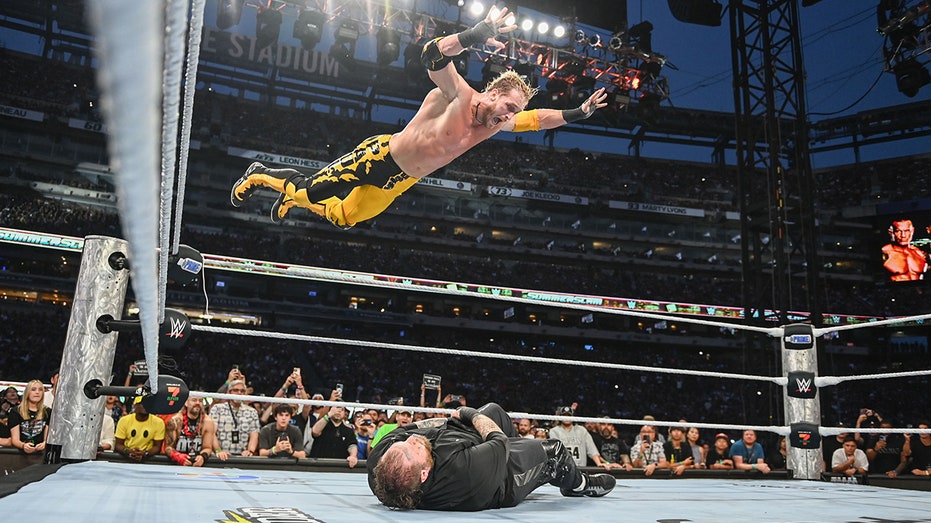 Logan Paul provides highlight reel moment with frog splash onto Jelly Roll through table at SummerSlam