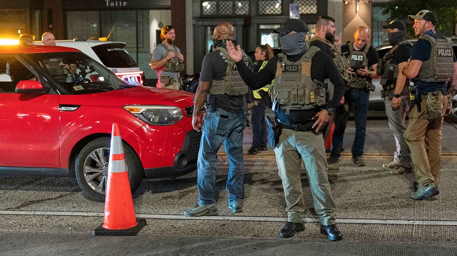 Police in DC get yelled at while setting up checkpoint along popular nightlife corridor