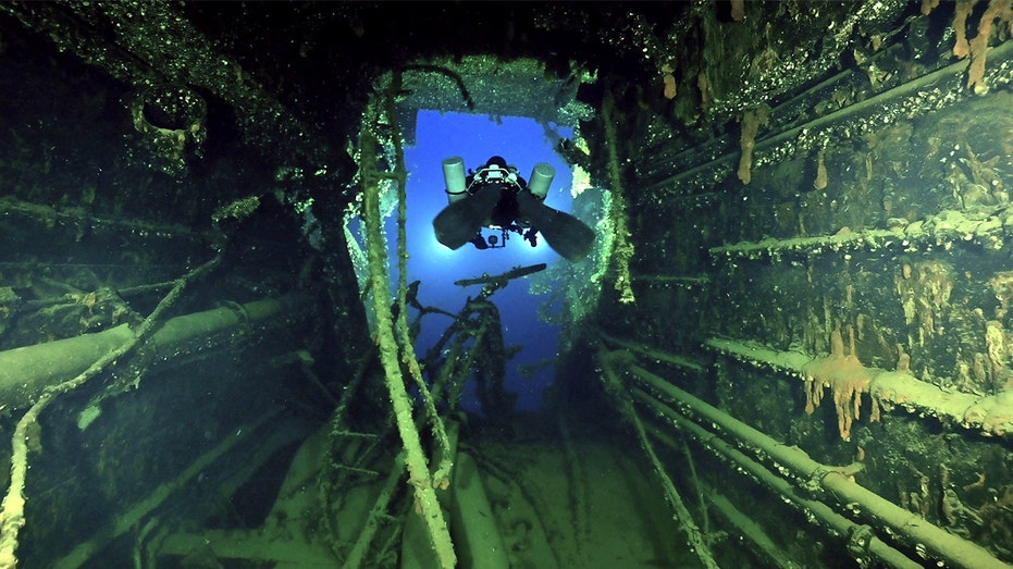 Eerie images show century-old wreck of Titanic's sister ship as divers recover artifacts for first time