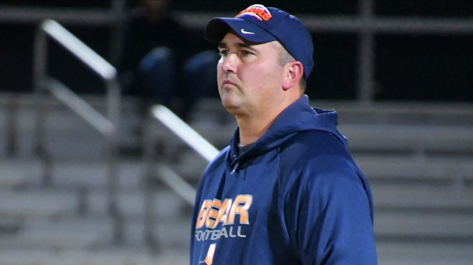 Fugitive high school coach erased as school scrubs staff profile amid child porn charges: report